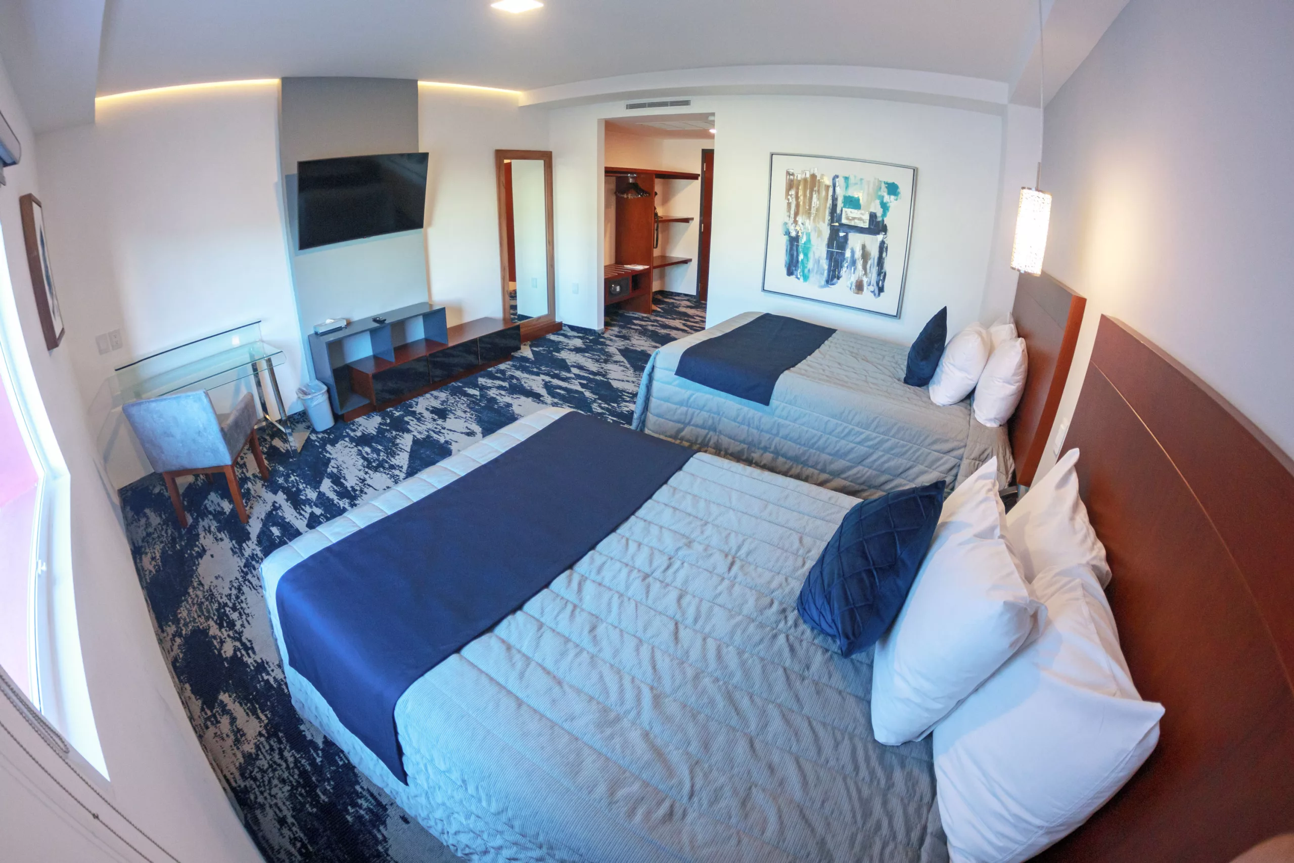 Habitacion con dos camas dobles del Hotel Fray Select en Tepic